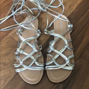 Express tri-tone gold leatherette sandals.